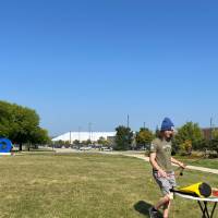 Student using atlatl